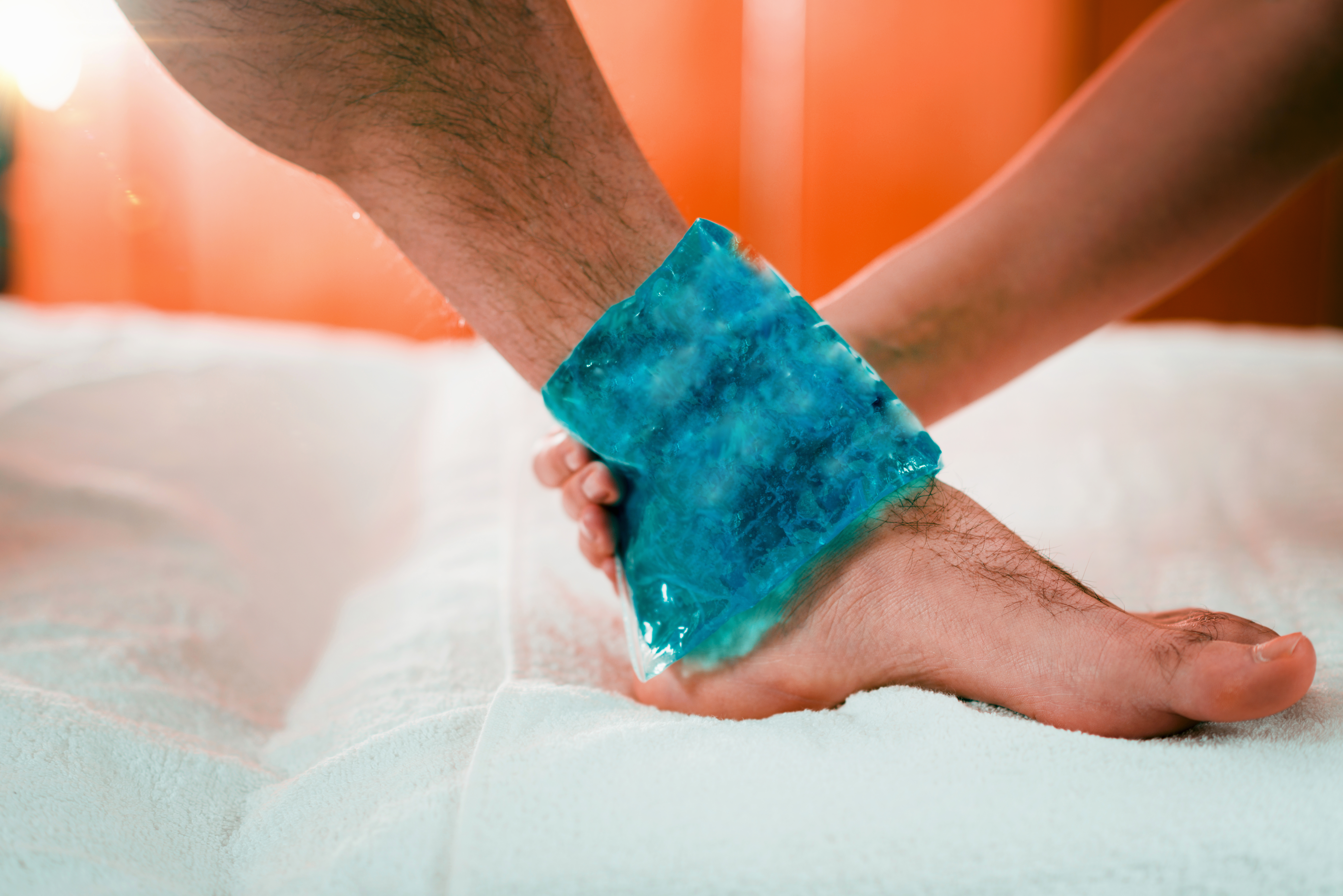 Close up of man's foot with cold compress.
