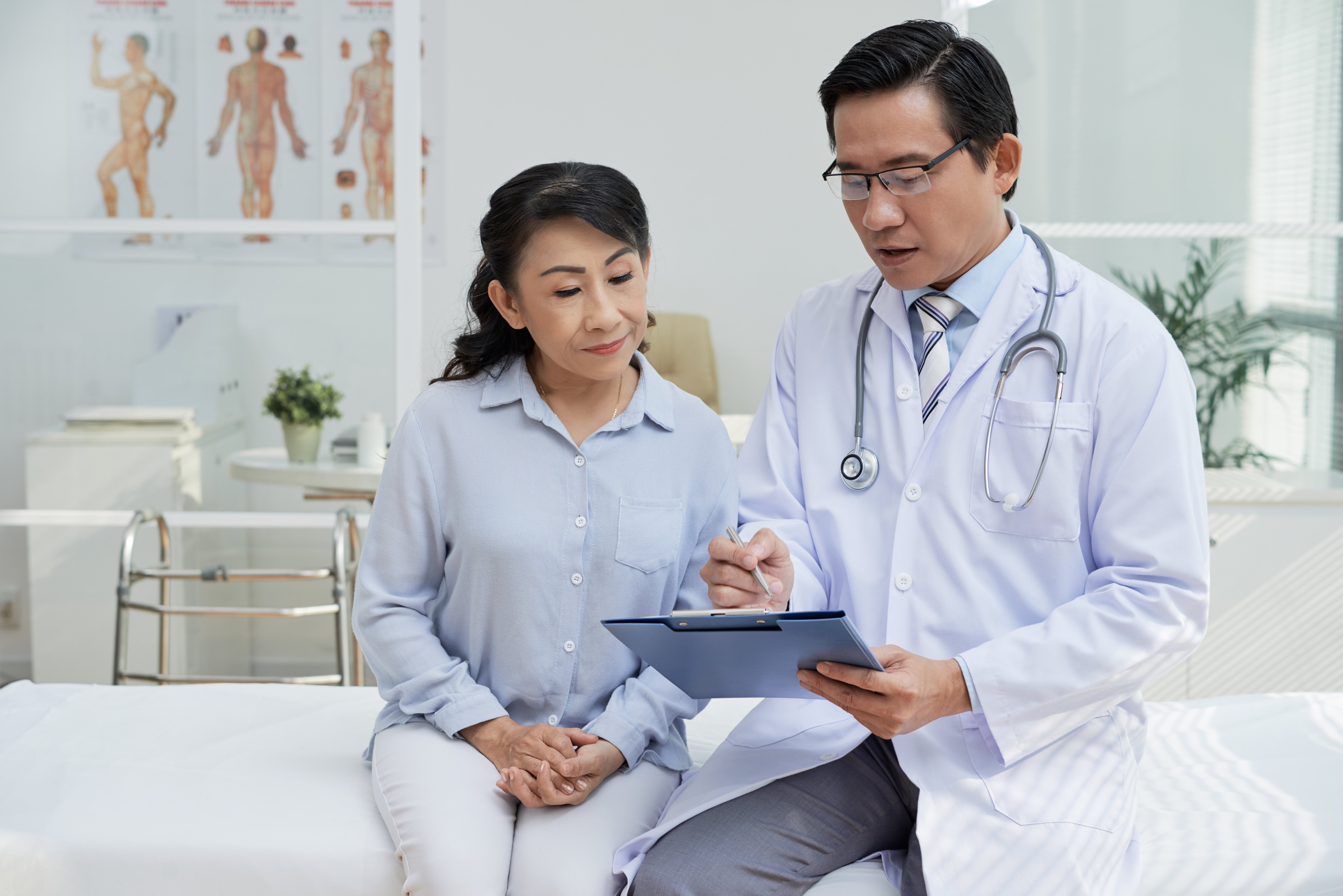 Doctor talking to patient in doctor's office