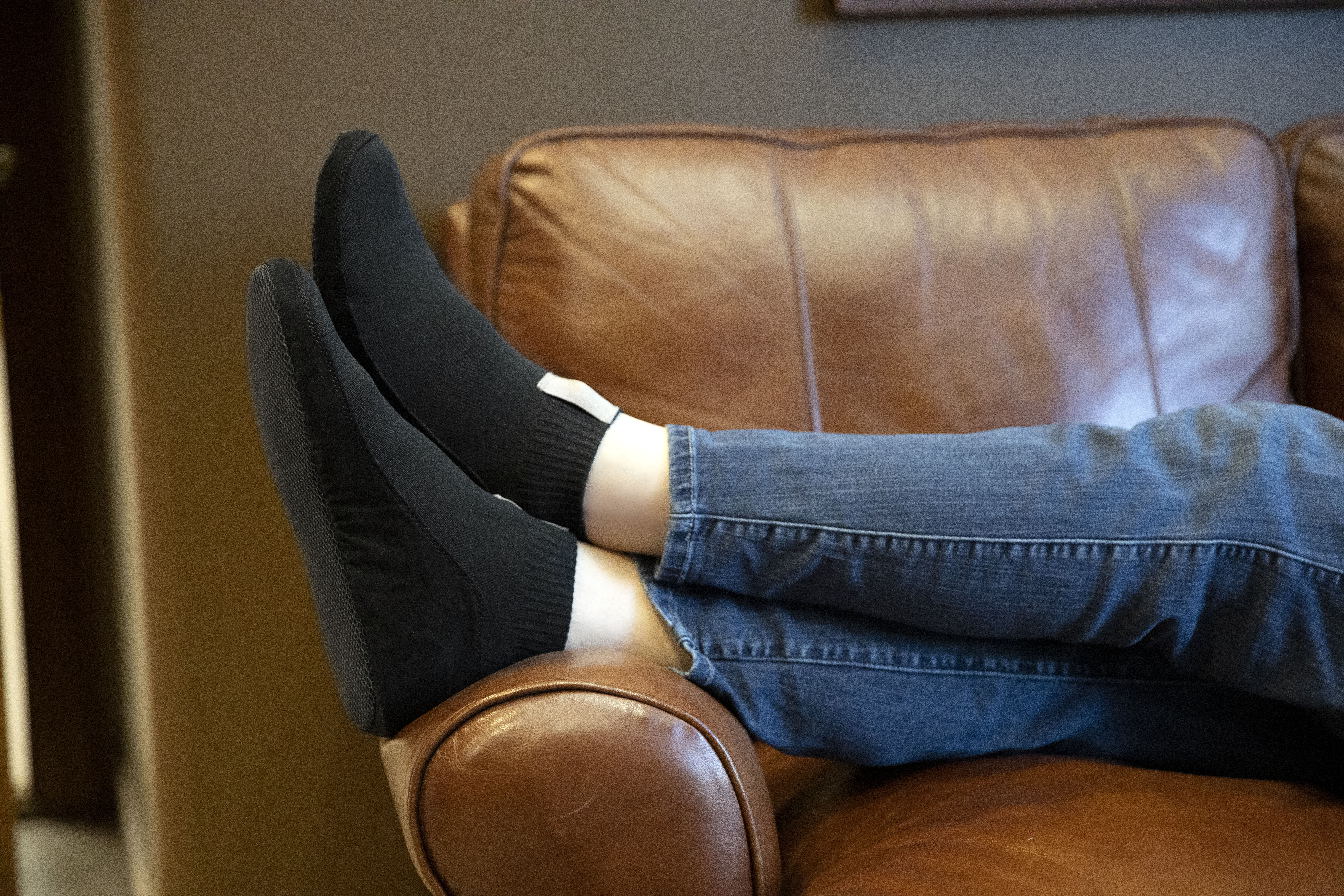 Close up of person wearing Unisex Basis Slip-On Slipper - Black
